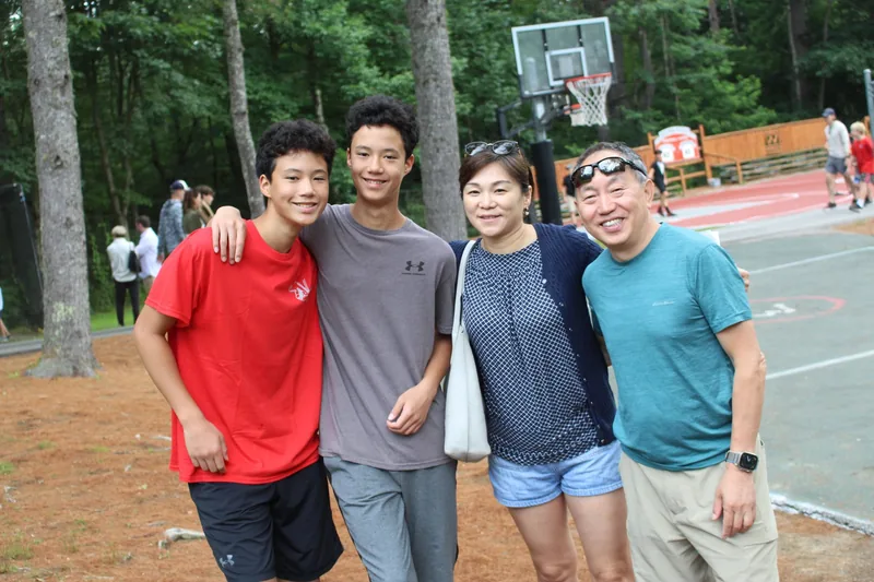 Parents and campers reuniting on Camp Wigwam's visiting day in mid-summer