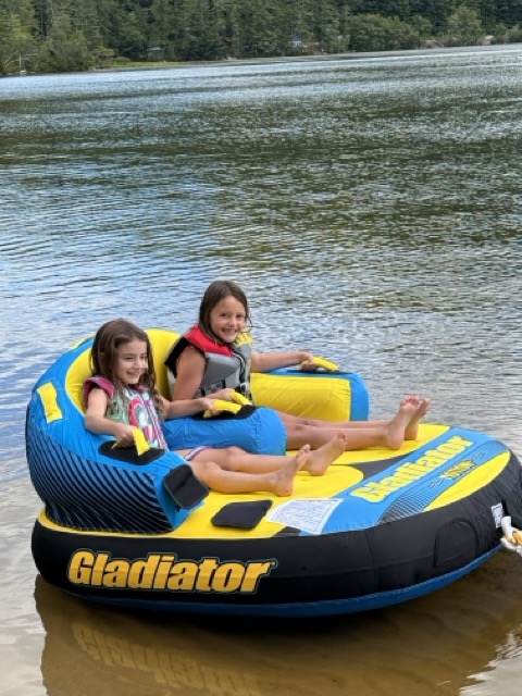 Two Little Loons riding a Gladiator tube on Bear Pond